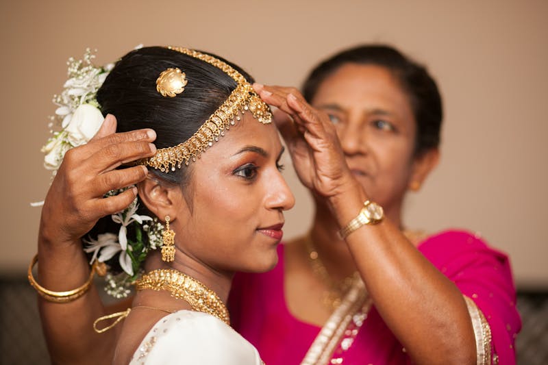 Sri Lankan couple celebrates outdoor wedding ceremony in traditional attire