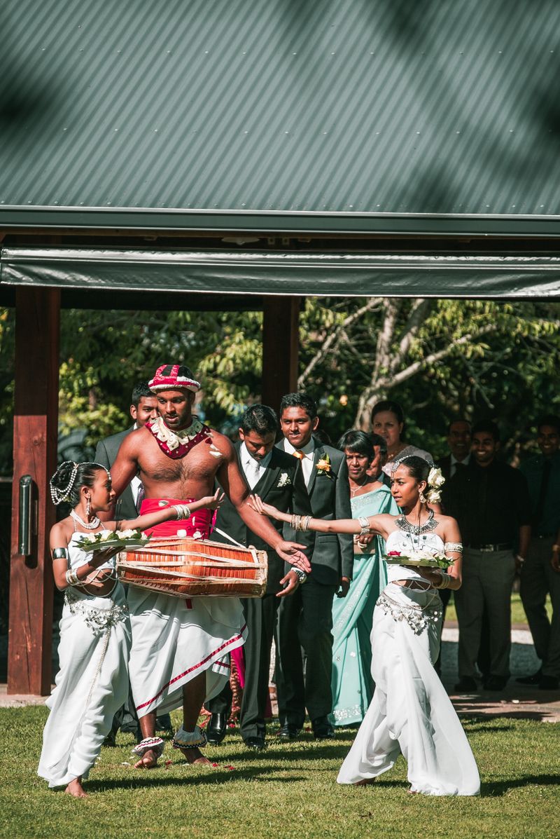 Kandyan drummers playing geta bera during Sinhalese wedding